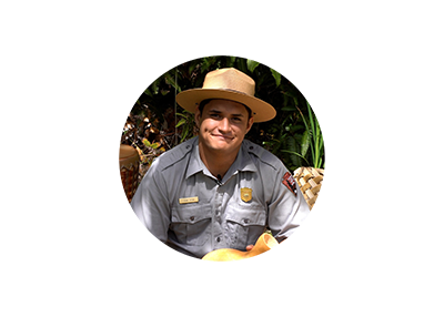 What does aloha mean to you? A ranger outside smiling.