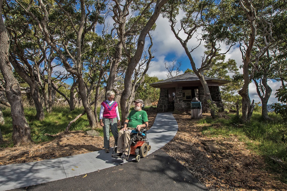 Man in wheelchair on new path