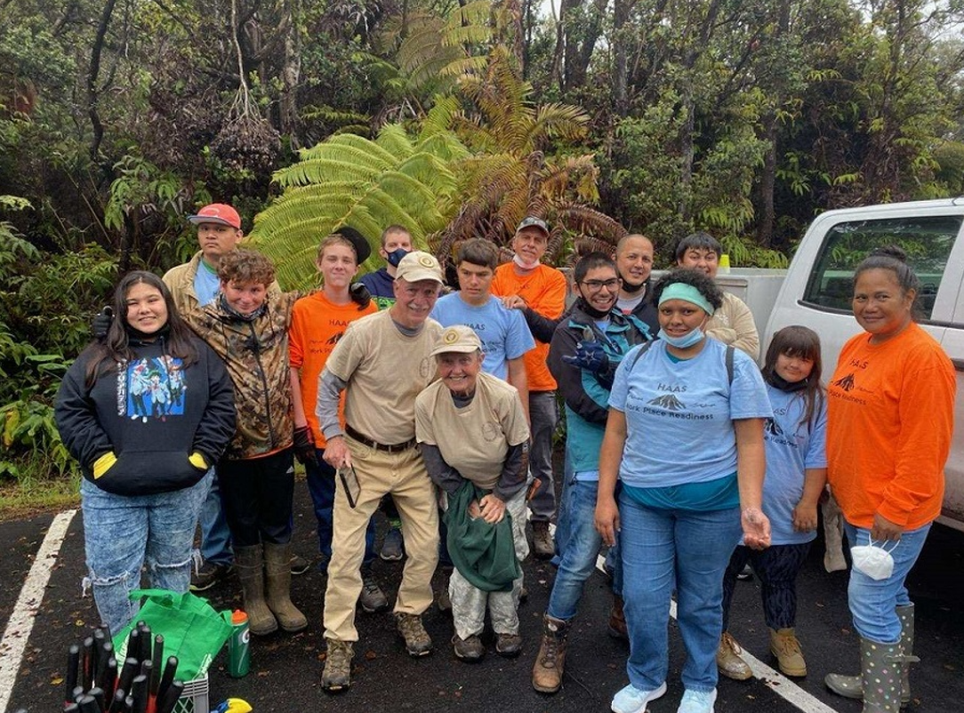 Volunteers prepare to go into the forest