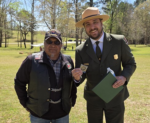 Park Superintendent standing with a Mvskoke Rider