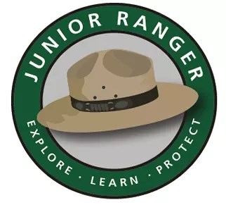 Junior Ranger Explore learn protect logo featuring a national park service ranger flat hat