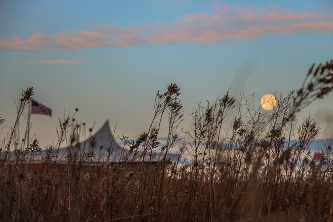 The full moon rises over the Heritage Center at Homestead National Monument