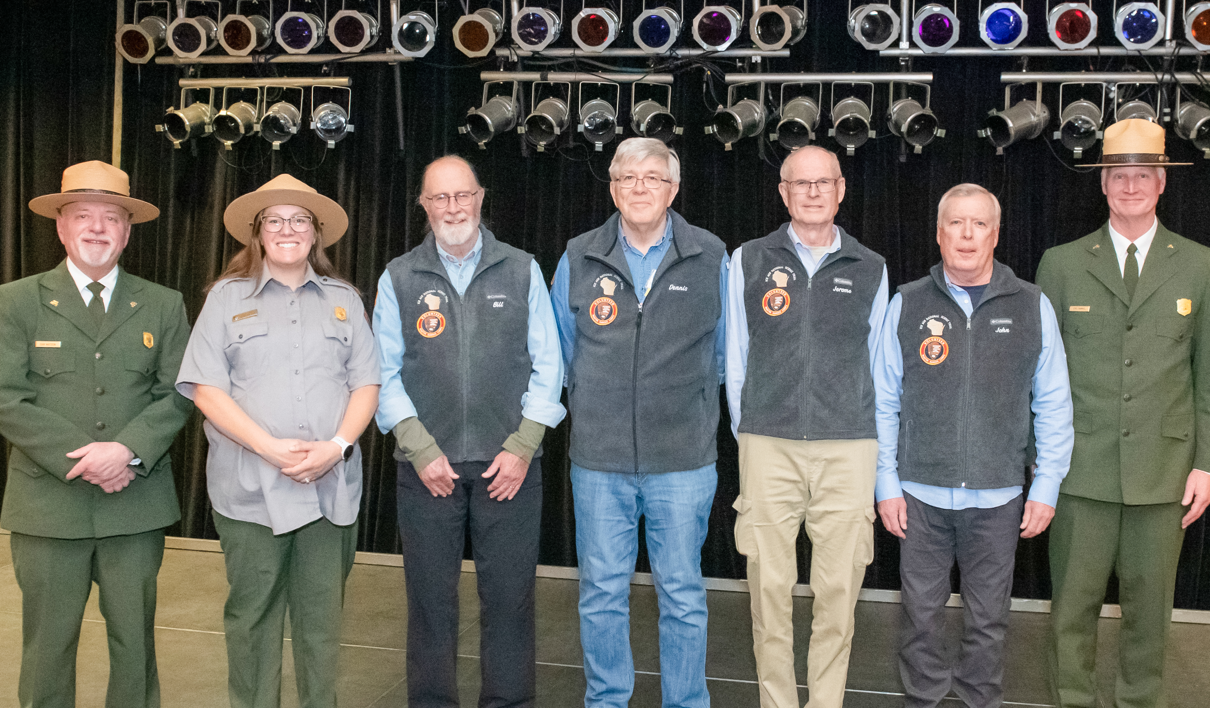 NPS staff with volunteers receiving 6000-hour Master Ranger Corps vest