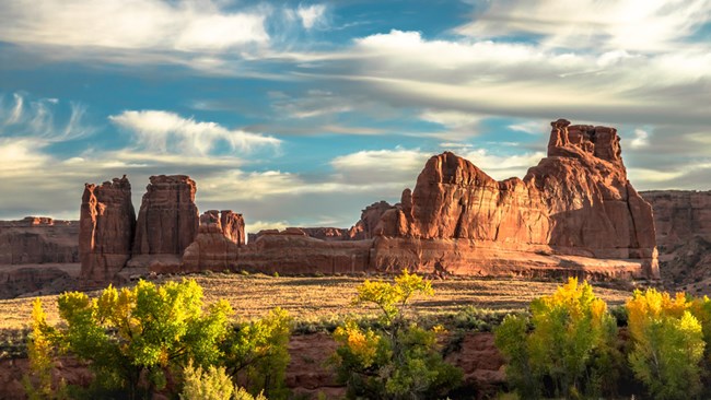 Courthouse Wash in Arches National Park Redrock spires contrast with cottonwoods changing to fall colors