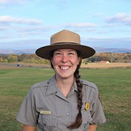 Lindsay_Ashley headshot of smiling woman in park service ranger hat