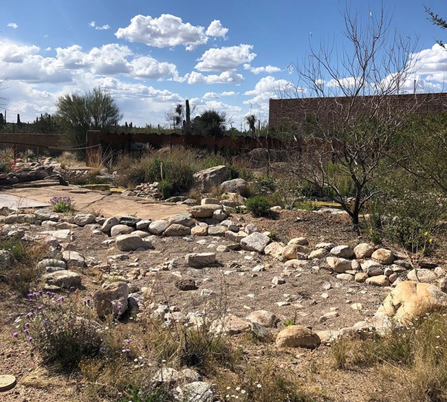 Rock-lined gravel area in landscaping