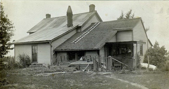 Historic photograph of an old Indiana farm house in the early 1900s.