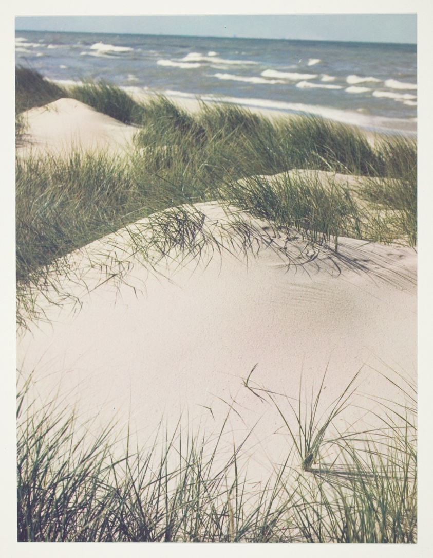 Historic early color photograph by Jun Fujita of Indiana's coast. Rolling waves on the lake and soft grass covered dune lumps