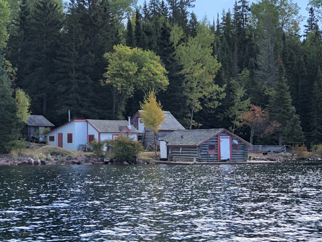Four historic buildings located on the water.
