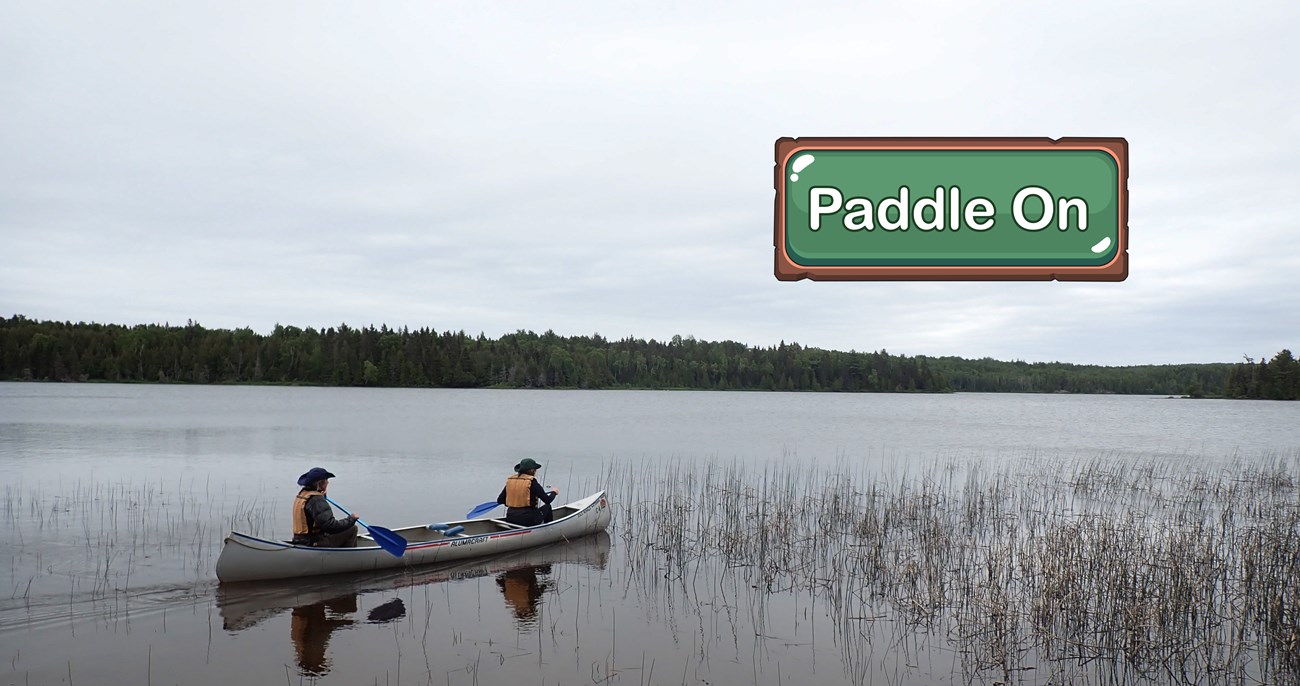 Two people in a canoe on a lake.
