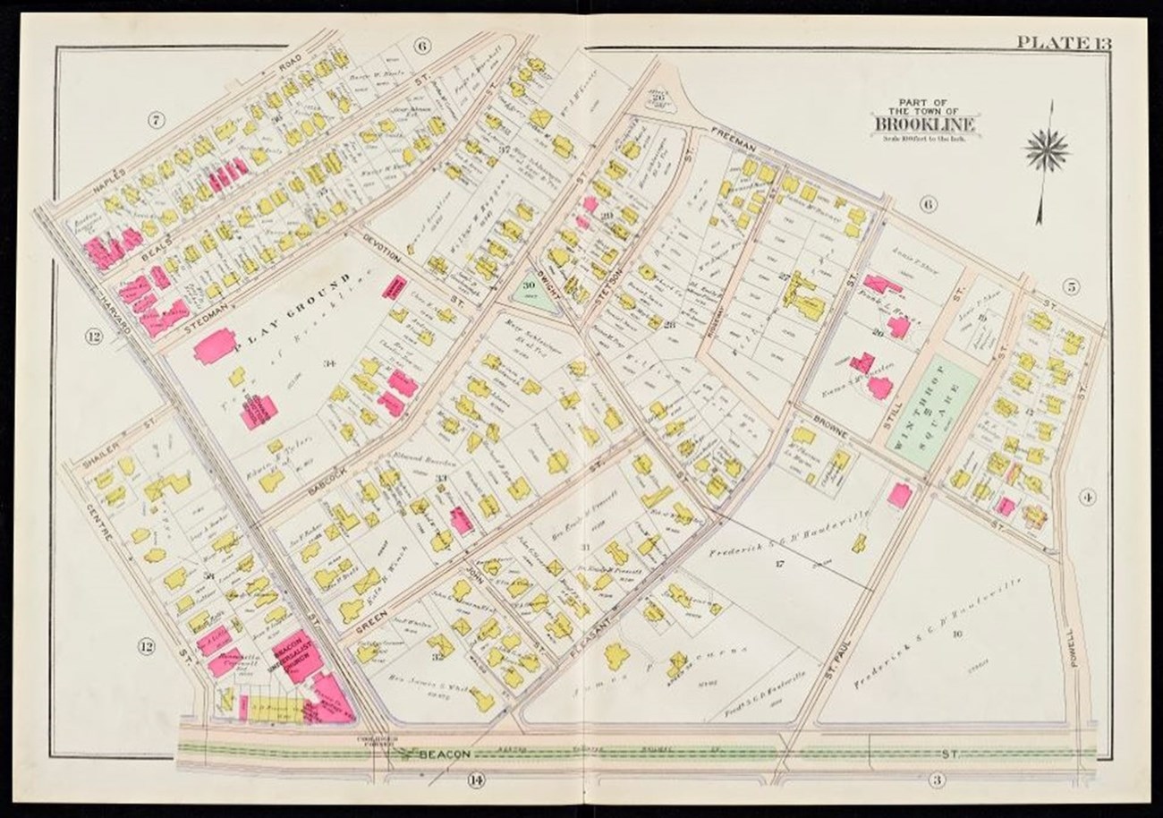 An ink drawn, colorful, paper map of part of the town of Brookline in 1907, with some buildings colored with pink ink, and most buildings colored with yellow ink.