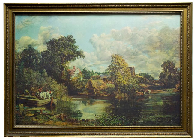 A painting of a white harnessed horse being ferried across a river by four men in a pole boat. A thatched boathouse and rowboat, brush, reeds, and three wading cows are on the river’s edge. Cottages and trees fill the background, and a partly cloudy sky.