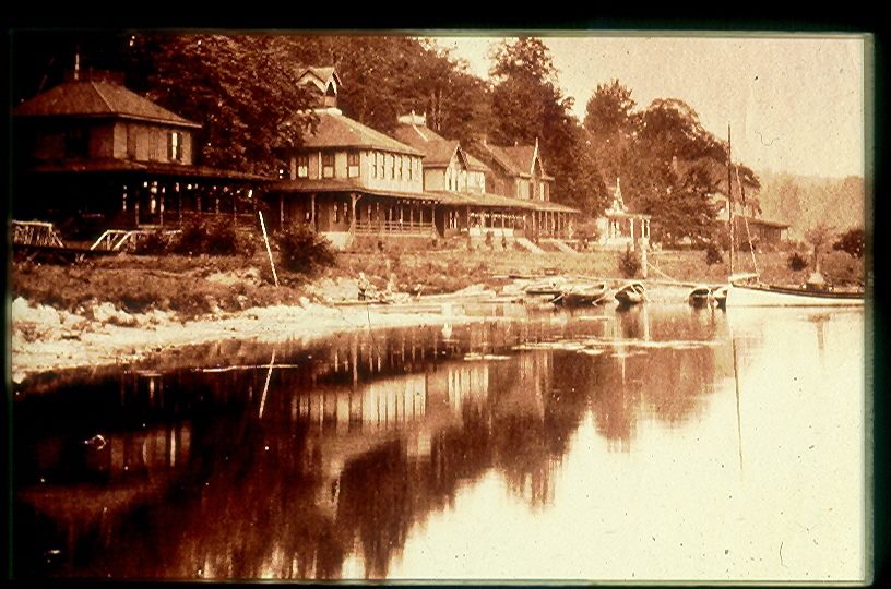 A row of cottages along a lakeshore.