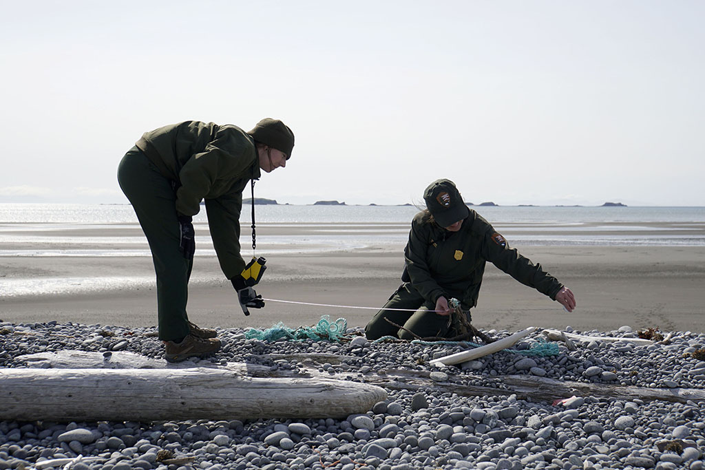 Rangers Kelsey and Carissa measure debris for the Marine Debris Survey. NPS Photo/Kaitlyn Kunce