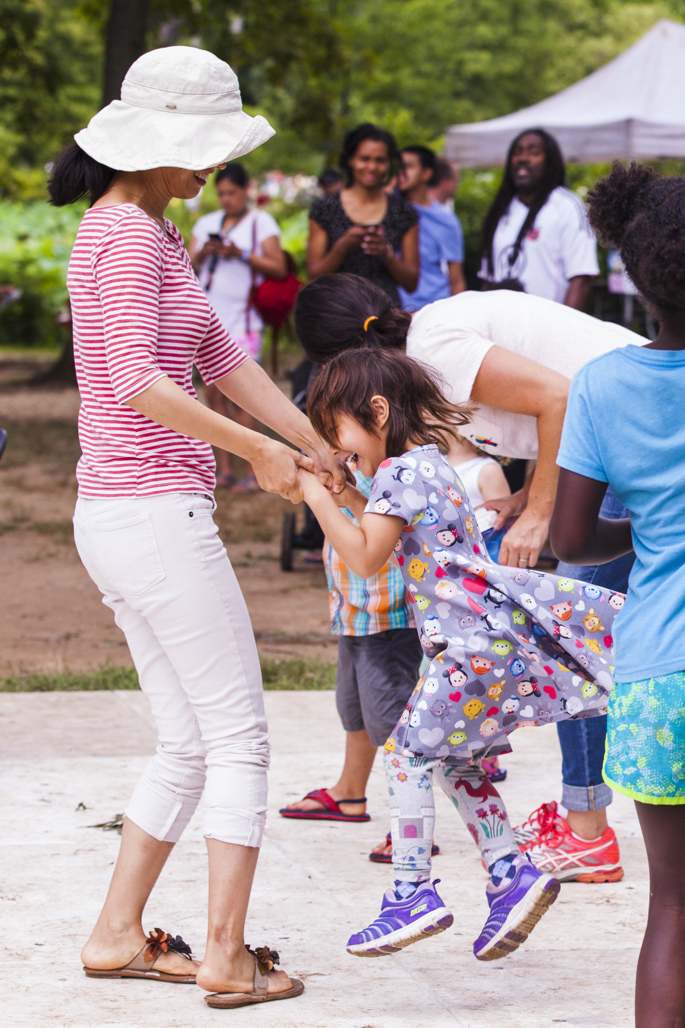 Woman and child dancing at the festival.