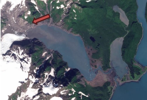 Satellite image of Pedersen Lagoon with a red arrow pointing to landslide origin.