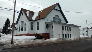 A church surrounded by snow.