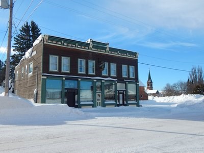 A two-story building with a lower level storefront.