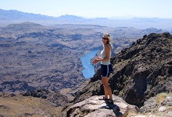 Adventurer in the Black Canyon Wilderness looking over the Colorado River below Hoover Dam