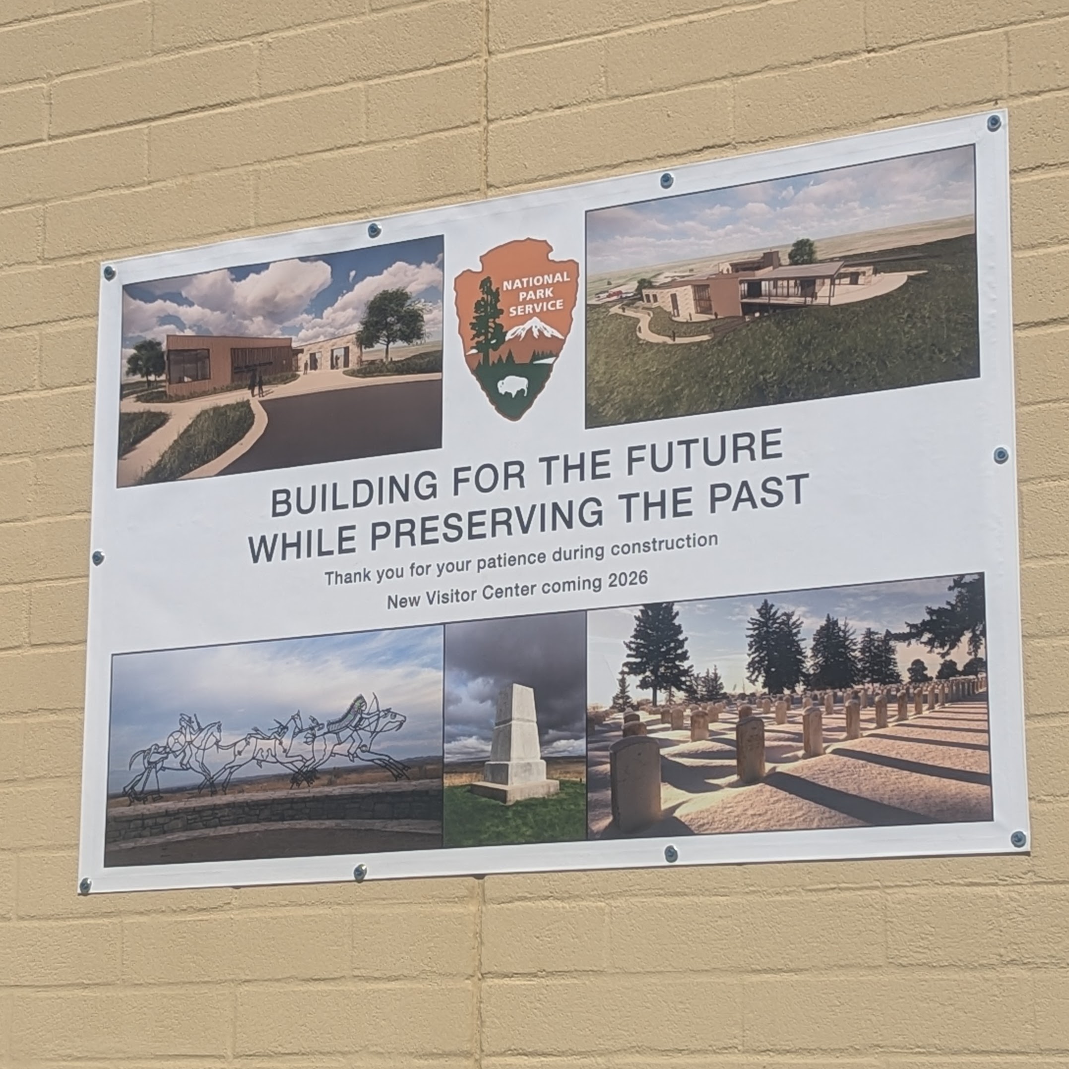 Banner displaying photos of new visitor center, Indian Memorial, 7th Cavalry Memorial, Custer Cemetery, and NPS Logo. Text: Building for the future while preserving the past. Thank you for your patience during construction. New Visitor Center coming 2026