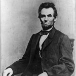 black and white portrait of lincoln from waist up; seated