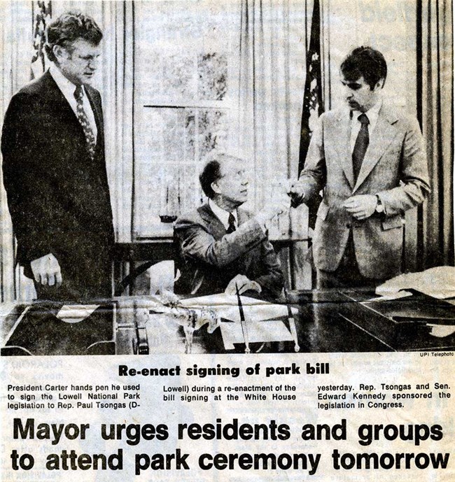 Newspaper cover of Jimmy Carter signing bill with Kennedy and Tsongas.