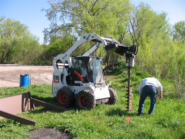 Nebraska Mormon Trail Association volunteers installing and interpretive exhibit.