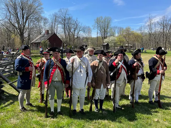 Reenactors in Continental Army uniforms at the Jockey Hollow encampment