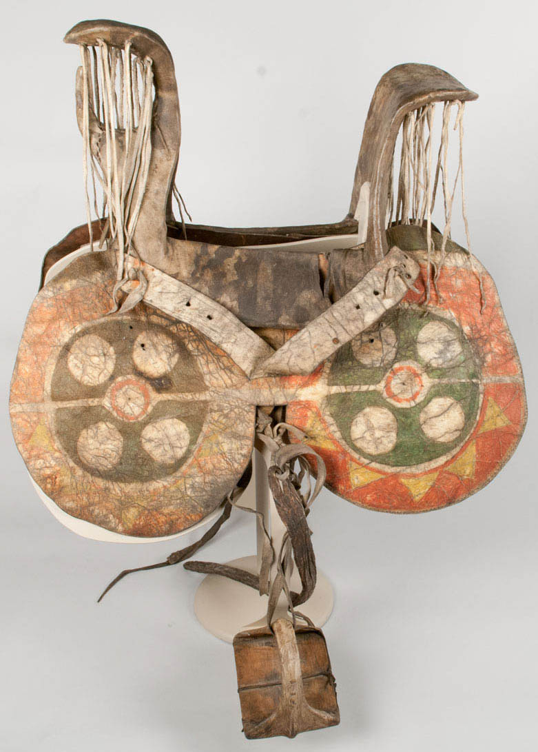 Women's saddle, constructed from cottonwood/willow (portion of the stirrups) and covered in rawhide