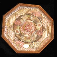The octagonal box contains shells woven into an intricate pattern.