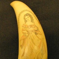 Etching of a girl in a pink dress on a sperm whale tooth.