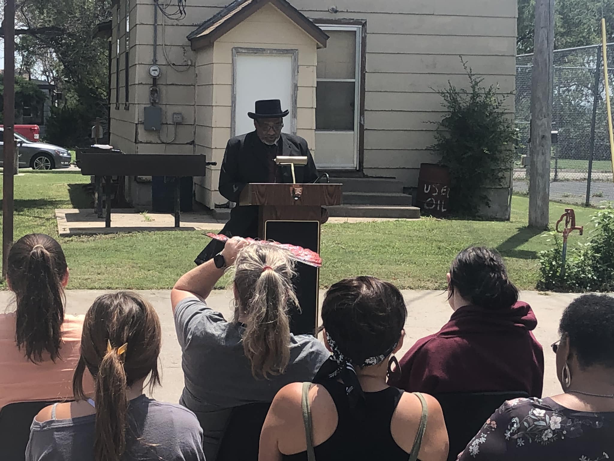 A man gives a speech at a podium