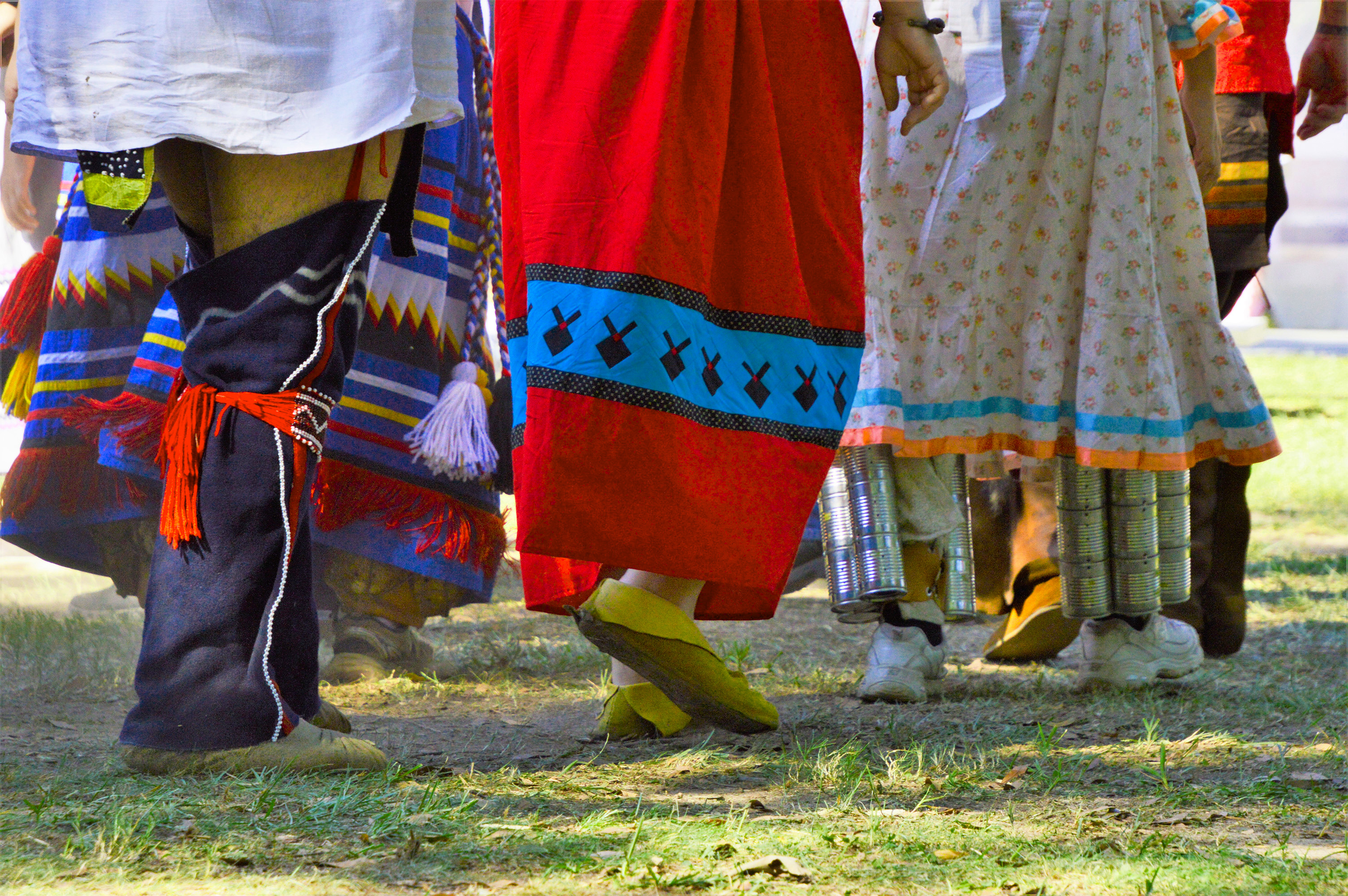 dancers in traditional attire; image focused on legs and feet