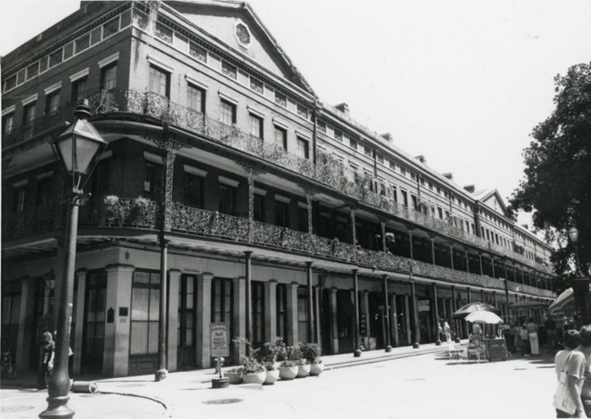 Pontalba_NOLA Two story building on a corner street of New Orleans.
