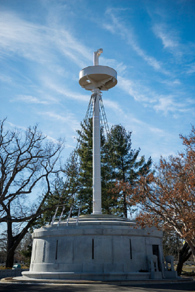 USS Maine Memorial Restoration A tall and white structure with a poll in the middle