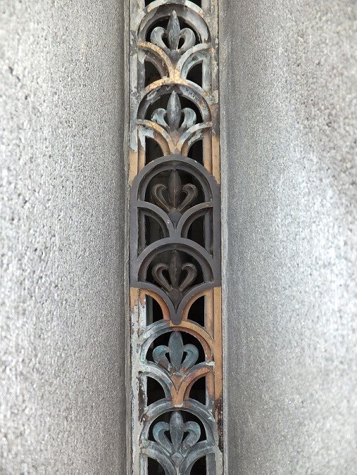 A close up of bronze fleur de lis