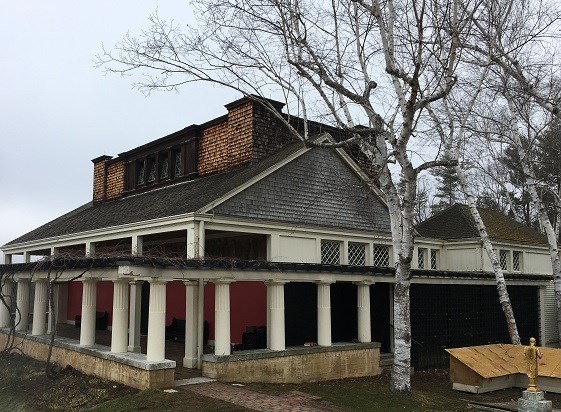 The Little Studio before the project work A white building with a grey roof surrounded by columns