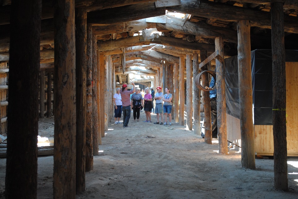 Heart Mountain Root Cellar with visitors