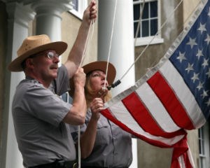 Park rangers raise flag