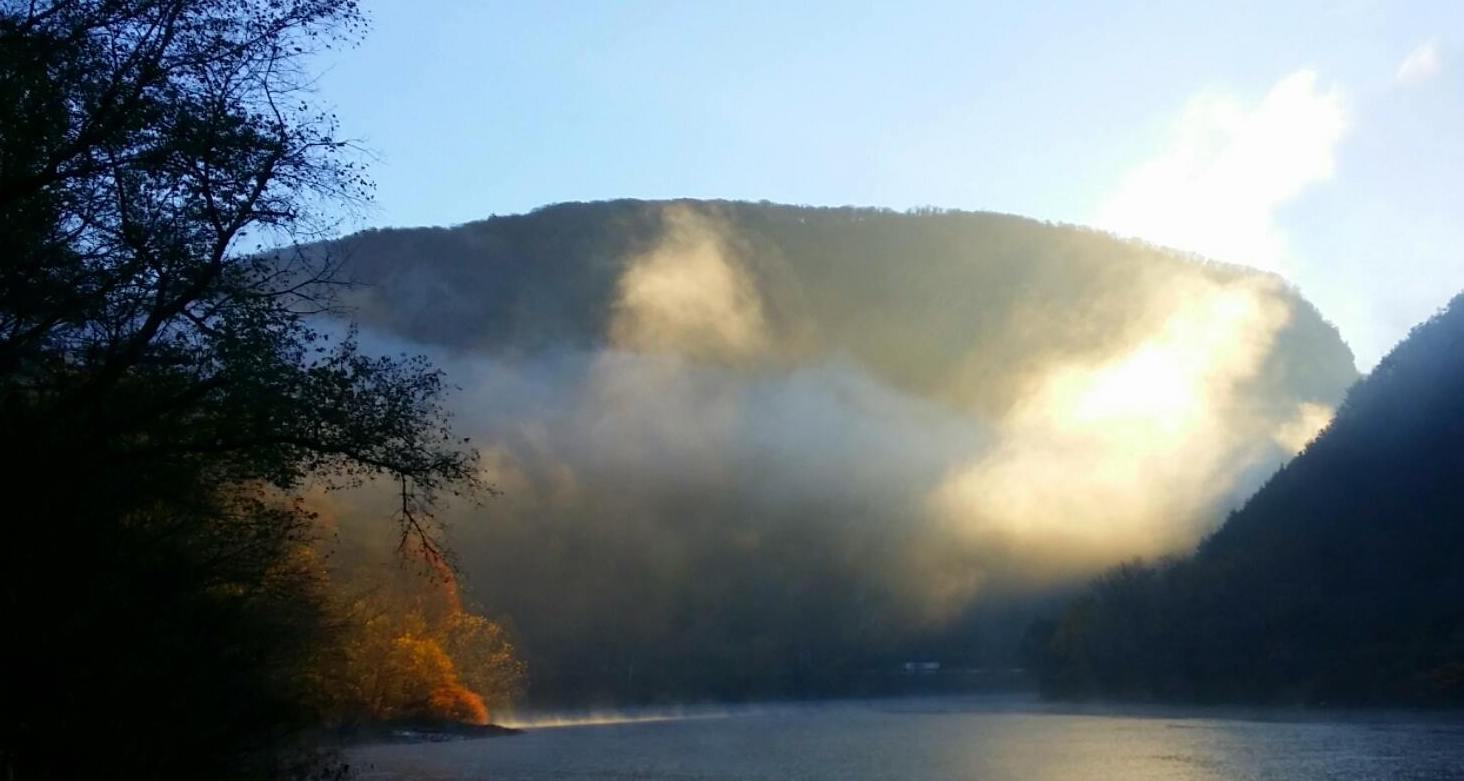 Sunlit mist over the water and fall colors viewed from Kittatinny Point in Delaware Water Gap National Recreation Area. NPS photo by A BeBault.