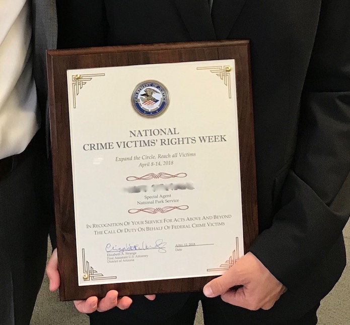 The US Attorney's Office presented an ISB Special Agent with a certificate during National Crime Victims' Rights Week.