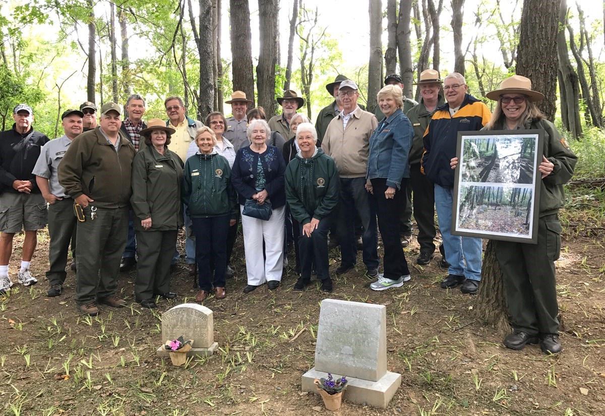 NPS staff and members of the Sorber family in restored cemetary