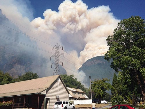 lt= residential area with wildfire smoke in the distance
