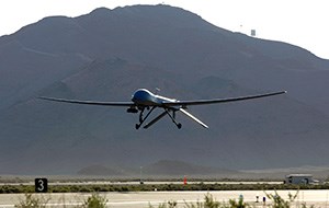 A large unmanned aircraft comes into a runway for a landing.