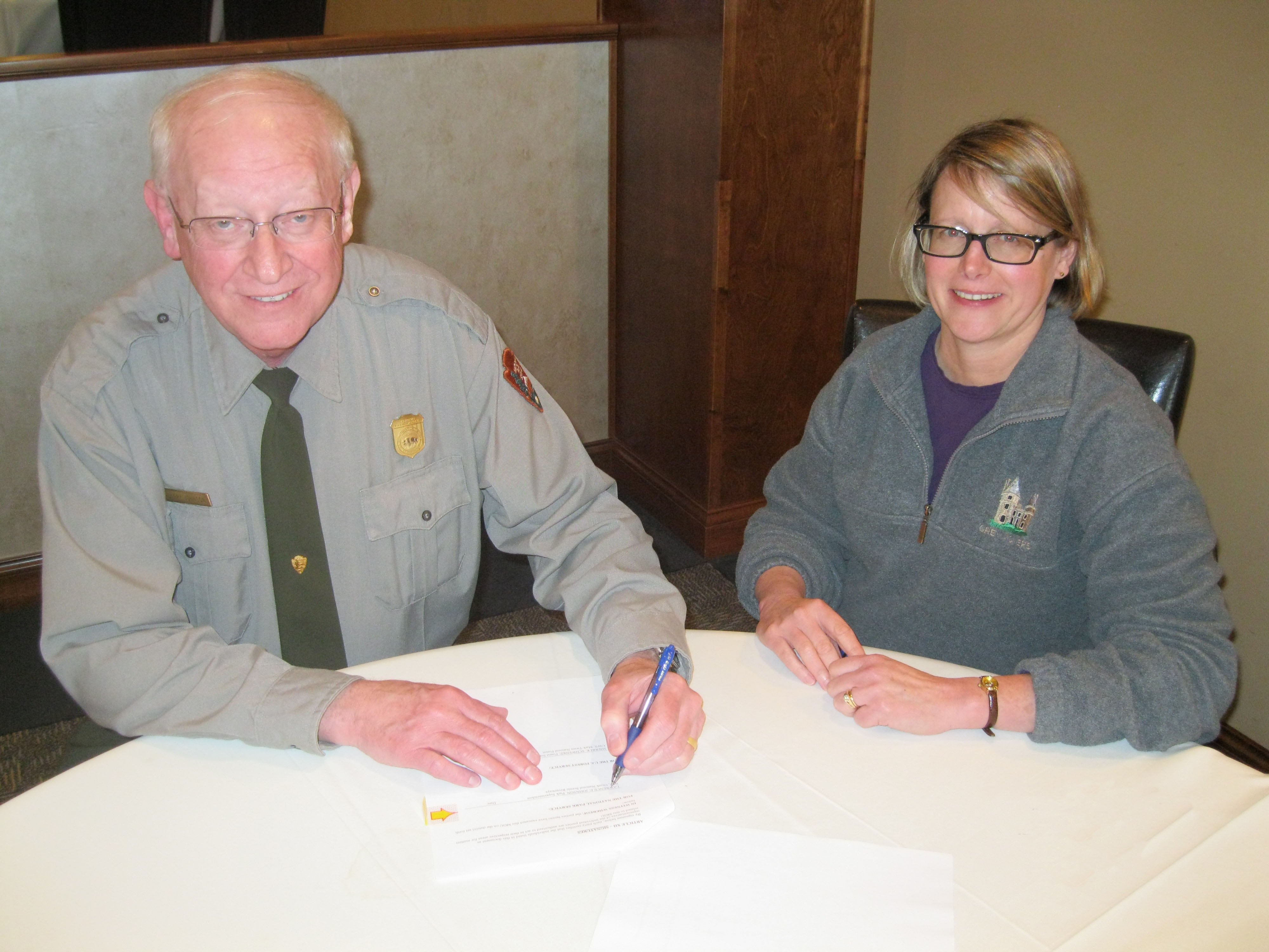 Ozark National Scenic Riverways Superintendent Larry Johnson and Mark Twain National Forest Supervisor Sherri Schwenke sitting at table