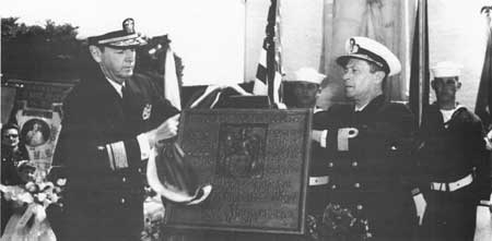 naval officers dedicating plaque