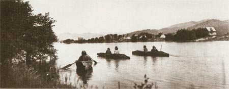 Native Americans in canoes