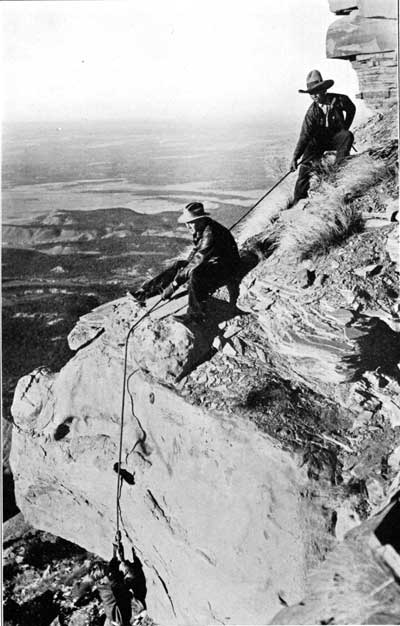 workers descending cliff