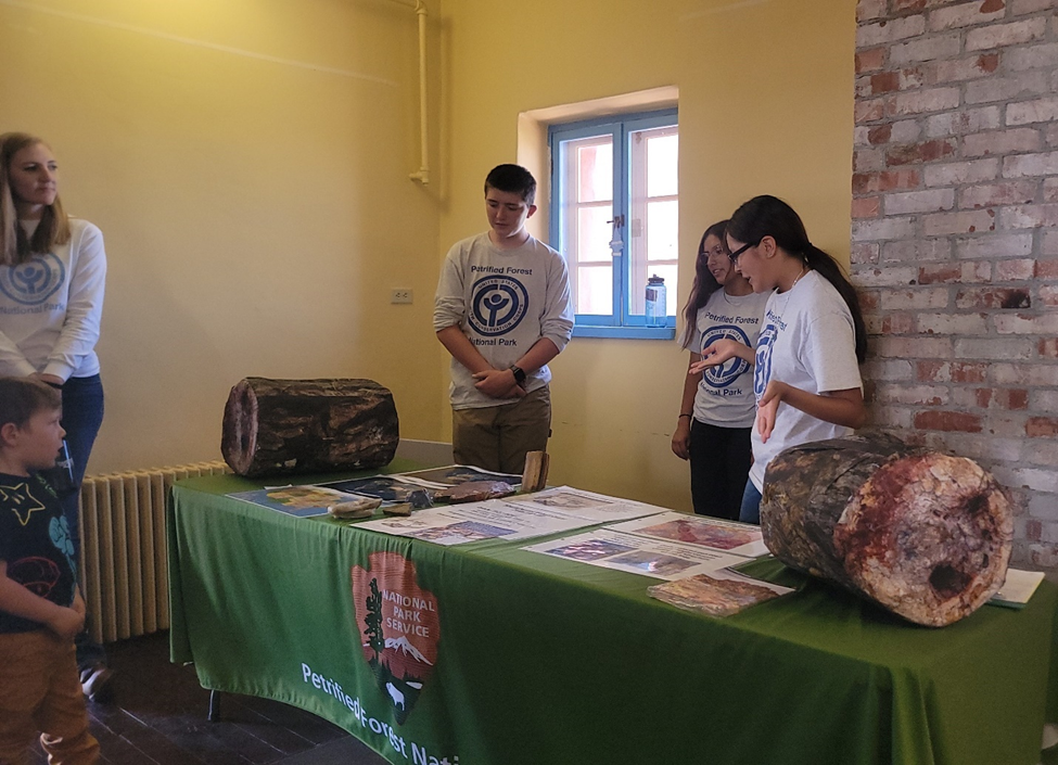 YCC crew members Ezekial Knight, Elena Philpott, and Alisa Johnson presentation about petrified wood