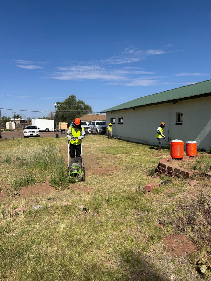 Cleaning up at the Holbrook Public Library Community Garden